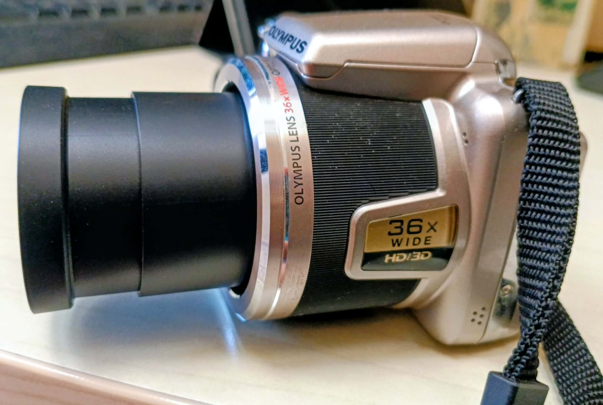 OLYMPUS SP-810UZ- superzoom- 3D- video